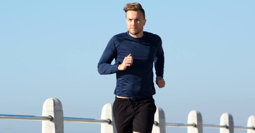 Man in dark blue shirt going for a run (MODEL)